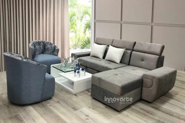 Sofacama modular en forma de L tapizado en tela gris, ideal para espacios modernos y versátiles
